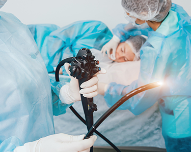 two doctors performing surgery on a patient in a hospital