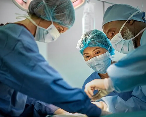 a group of doctors performing surgery on a patient