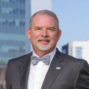 a man wearing a suit and bow tie