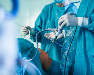 a group of surgeons performing surgery in a hospital