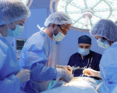 a group of doctors doing surgery of patient